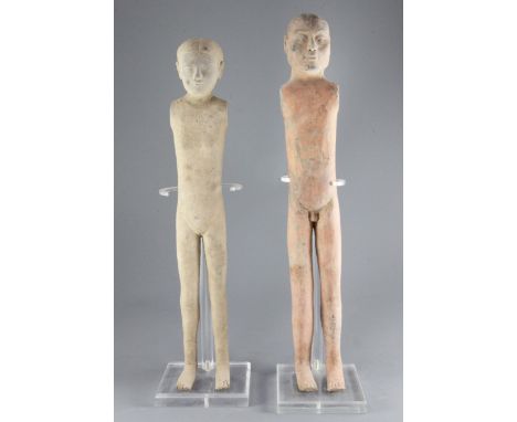 Two tall Chinese pottery stick figures of men, Han dynasty (206BC - 220AD) each lacking arms, 56cm and 60cm, modern standsPro