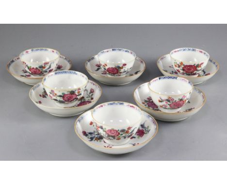 A set of six Chinese famille rose and underglaze blue teabowls and saucers, Qianlong period, each painted with floral sprays 