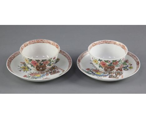A pair of Chinese famille rose teabowls and saucers, Yongzheng period, each finely painted with a basket of flowers and a bow