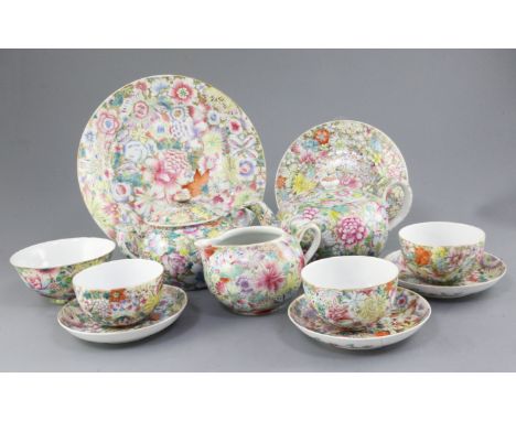 A Chinese famille rose millefleur twenty six piece tea service, Qianlong and Guangxu marks, c.1900, including a compressed gl