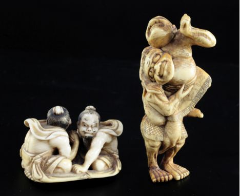 Two Japanese ivory netsuke of wrestlers, 19th century, the first of two arm wrestlers seated on a rush mat, the rope cords ca