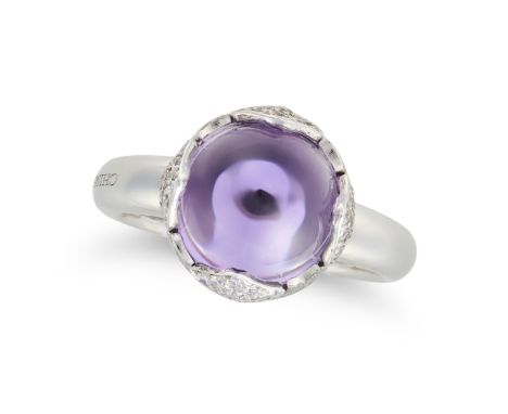 CHIMENTO, AN AMETHYST AND DIAMOND RING in 18ct white gold, set with a round cabochon amethyst, accented by pave set round bri