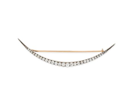 AN ANTIQUE DIAMOND CRESCENT MOON BROOCH in yellow gold and silver, designed as a crescent moon, set with a row of old and ros