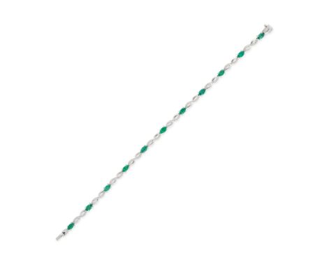 AN EMERALD AND DIAMOND BRACELET in 18ct white gold, comprising a row of oval cut emeralds and figure of eight links set with 