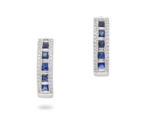 A PAIR OF SAPPHIRE AND DIAMOND HUGGIE HOOP EARRINGS in 18ct white gold, each set with a row of square step cut sapphires acce