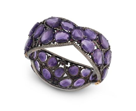 AN AMETHYST, RUBY AND DIAMOND BANGLE the hinged bangle set with fancy cut amethysts, accented by round cut rubies and round c