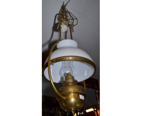 A Veritas pendant brass oil lamp with a white glass shade, now converted to electricity.