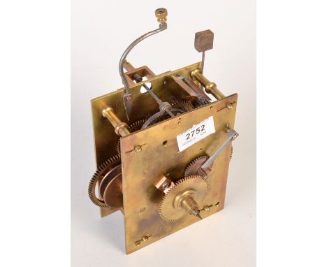 A brass clock movement by Houghton.