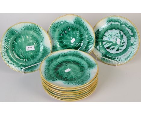 A set of eleven majolica basket and leaf moulded plates, each diameter 22.5cm. Condition Report: In good condition, some ligh