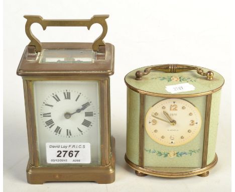 A brass carriage timepiece and a Swiza oval brass and green enamel timepiece. 