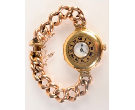 A ladies 18ct. gold half-hunter cased wrist watch, with Swiss Peerless movement, the case with blue enamel chaptering, the wh