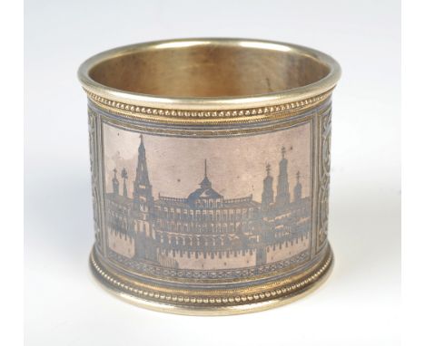 A fine Russian parcel gilt niello enamel napkin ring, decorated with arabesque and a central monogram, together with a panel 