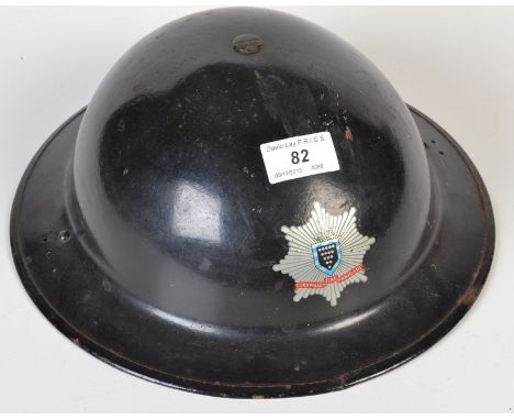 A WWII Cornwall Fire Brigade tin helmet.