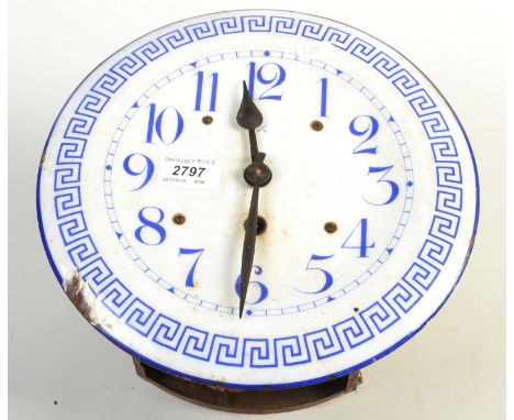 An enamelled continental wall clock.