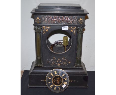 A 19th century black slate clock case and dial (lacks movement) with a copper figure decorated tympanium and brass pillars, h