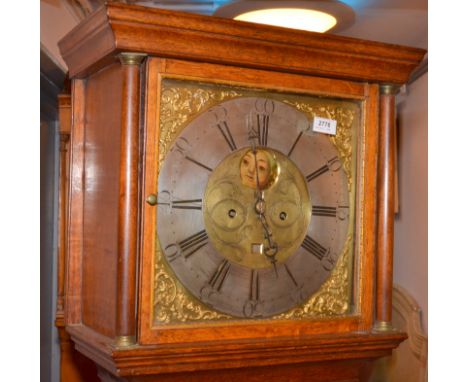 An eight day George III oak long case clock, the brass dial with a silver chapter ring and painted moon dial by Strandring Bo