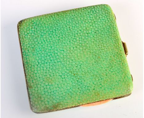 A shagreen covered compact.