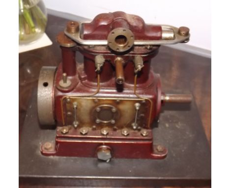 An engineer built scale model of a marine engine, width including flywheel 14cm, height 16cm.