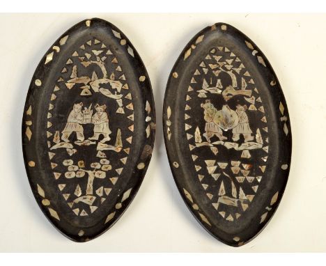 A pair of engraved mother of pearl inlaid, elliptical lacquered wooden trays, one shows boys carrying a giant fruit, the othe