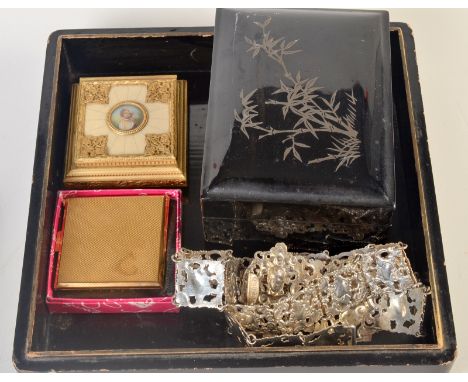 A gilt metal mounted ring box, the lid with a heightened military portrait, together with a Kigu compact, original box. Nesti