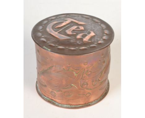 A Newlyn Copper circular tea caddy, relief decorated with fish amongst seaweed. Impressed Newlyn. Height 9.5cm, diameter 11.5