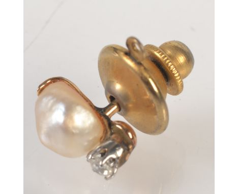 A baroque pearl and diamond stud.