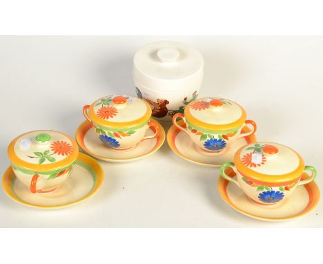 A set of four Art Deco soup bowls, covers and saucers, together with a Guinness advertising pudding bowl and lid by T.G. Gree