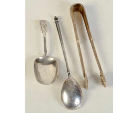 A Moscow silver engraved caddy spoon, dated 1894, one other Russian spoon, together with a pair of heavy Russian sugar tongs.