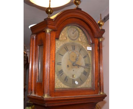 A George III mahogany eight day long case clock, the arched brass dial with a strike/silent dial arch.