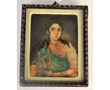 An Indian portrait miniature of Munmutaz Mahal, she sits in a green robe holding a rose, 8 x 6cm.