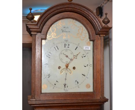 A Victorian eight day oak long case clock, the gilt painted arched dial with a subsidiary minutes dial and date arch by Wills