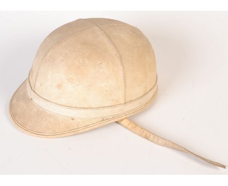 A white motorcycle helmet, the Skulgarde by Chas Owen Company.
