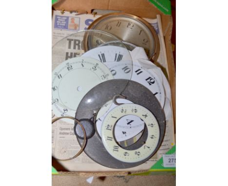 A box of clock dials etc.