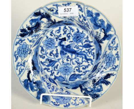 A Kangxi blue and white dish, the centre with a phoenix, restored, diameter 21.5cm. 