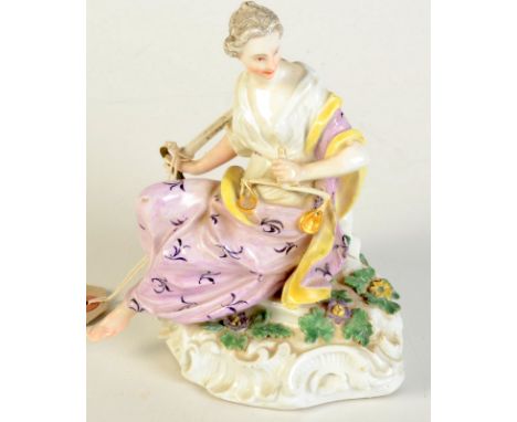 A Meissen porcelain figure of Justice in 18th century style, the seated female figure holds scales and a sword, rococo base, 
