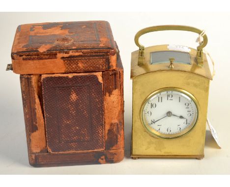 A French hour repeating carriage clock, in arched brass case, with lever escapement beneath a curved bevelled glass, the side