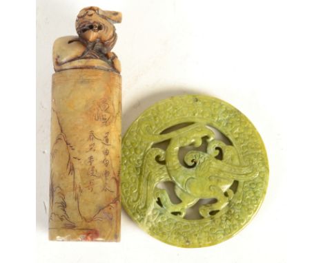 A Chinese green stained jade phoenix carved Bi and a carved soapstone seal. 