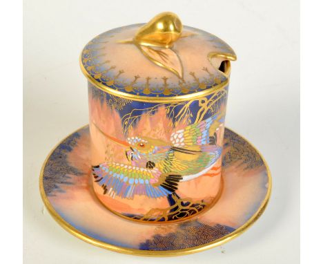 A Carlton Ware small preserve pot and stand gilt and enamelled with a crane in flight, the lid with a pear finial. Condition 