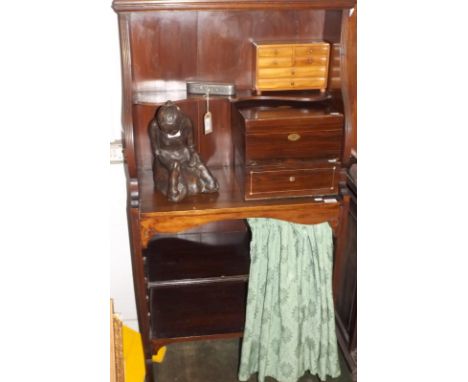 A narrow Regency style bookcase with a single open shelf above a curtained, adjustable shelf.