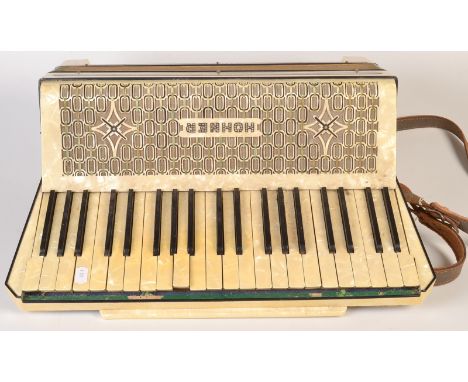 A Hohner Tango III piano accordion.