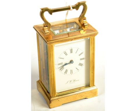 A post war brass carriage clock, signed J W Benson, London.