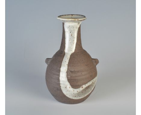 A Janet Leach dark stoneware bottle vase with twin vestigial lug handles, poured white decoration, Leach Pottery and personal