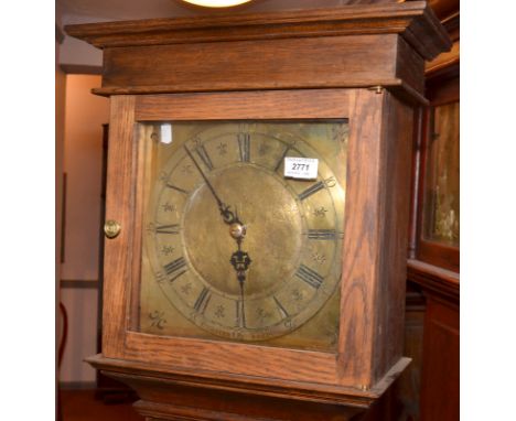 An oak and hardwood long case clock in George III style with a brass dial marked Bunster Truro