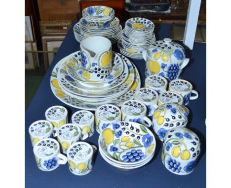 A collection of fifty six pieces of Arabia Paratiisi pattern tableware, including six oval serving dishes, biscuit barrel and