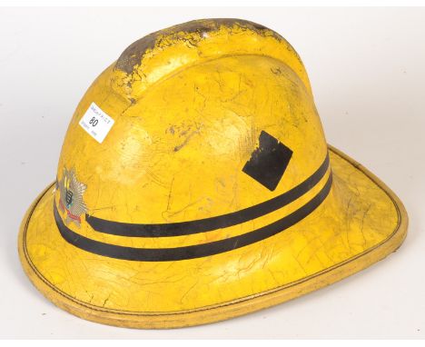 A 1980`s Cornwall Fire Brigade yellow helmet.