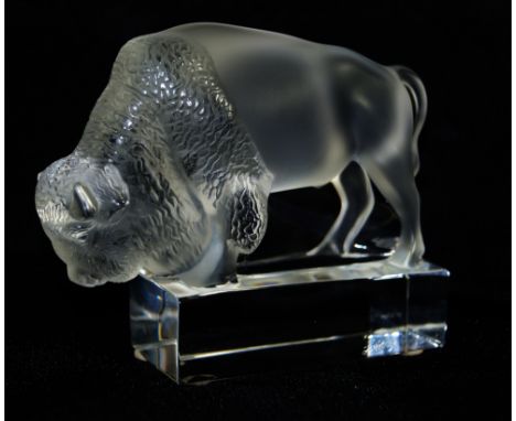 A Lalique France clear and frosted glass model of a BisonRaised on a rectangular plinth base, height 10cm, length 12cm   COND