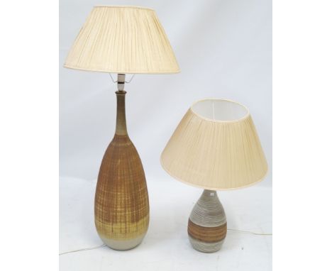 A large and impressive studio pottery floor lampBy David White, having vertical incised linear decoration on a brown and crea