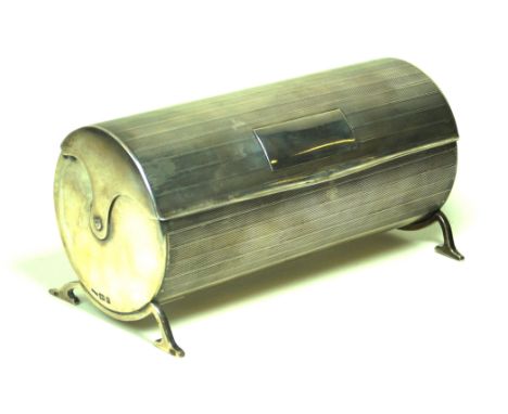 A George V Art Deco hallmarked silver cylindrical cigarette holderHaving engine turned decoration throughout with two ivorine