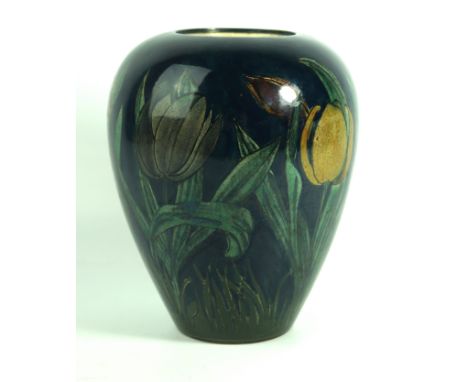 A Rozenburg DenHaag ceramic vase of ovoid formPainted with tulips and flowers on a cobalt blue ground, factory marks and numb