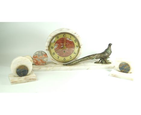 An Art Deco marble three piece clock garnitureThe circular clock face with Roman numerals flanked on one side by two smaller 